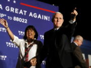 Republican vice presidential nominee Indiana Gov. Mike Pence, arrives with his wife, Karen, at a campaign rally at Cox Transportation Services in Ashland, Va., Monday Oct. 3, 2016.