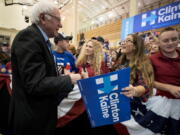 Scarlett Spager, 16, of Old Forge, Pa., smiles as she meets Sen. Bernie Sanders, I-VT, following a rally in support of Hillary Clinton and U.S. Senate candidate Katie McGinty at Scranton High School in Scranton, Pa. on Saturday.