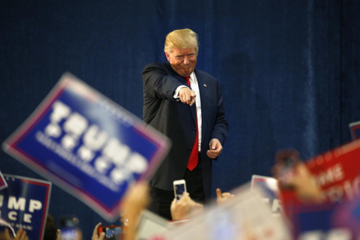 Republican presidential candidate Donald Trump gestures to supporters before speaking at a campaign rally at the University of Northern Colorado, in Greeley, Colo., on Sunday.