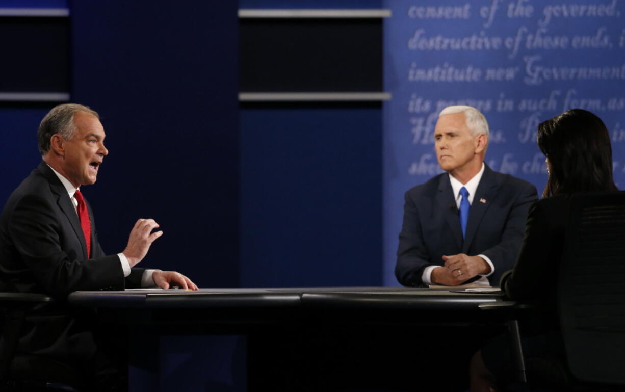 Republican vice presidential nominee Gov. Mike Pence, second from left, and Democratic vice presidential nominee Sen. Tim Kaine debate Tuesday during the vice presidential debate at Longwood University in Farmville, Va.