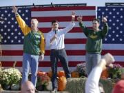 From left, U.S. Sen. Ron Johnson, House Speaker Paul Ryan and Gov. Scott Walker, acknowledge the crowd after they spoke at the "Fall Fest" Wisconsin Republican unity rally at the Walworth County Fairgrounds in Elkhorn, Wis. on Saturday, Oct. 8, 2016.