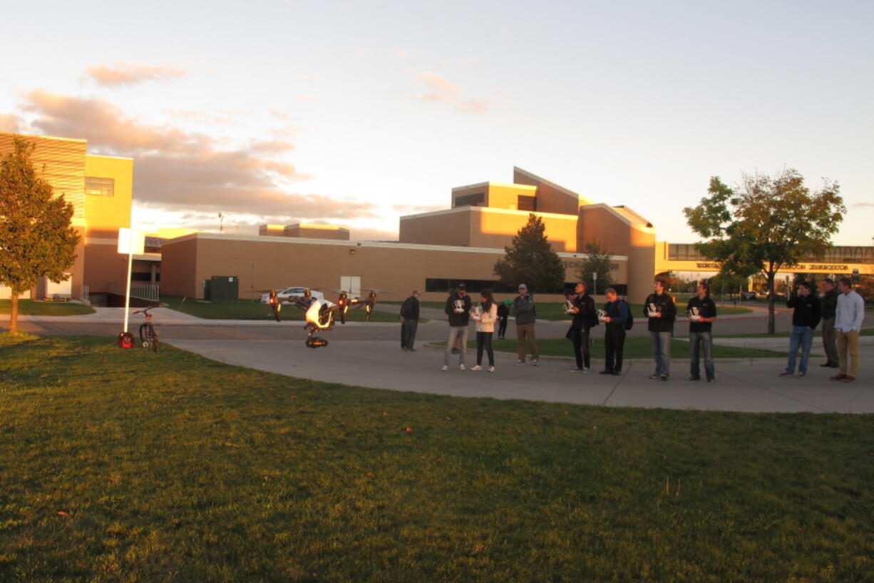 Students in the first unmanned aircraft business class at the University of North Dakota fly a drone outside the school. In addition to learning how to fly the aircraft, the students are receiving real-world business experience and will end the semester by presenting their ideas for a business to executives. There are 24 students in the inaugural class that is part of the college&#039;s business school.