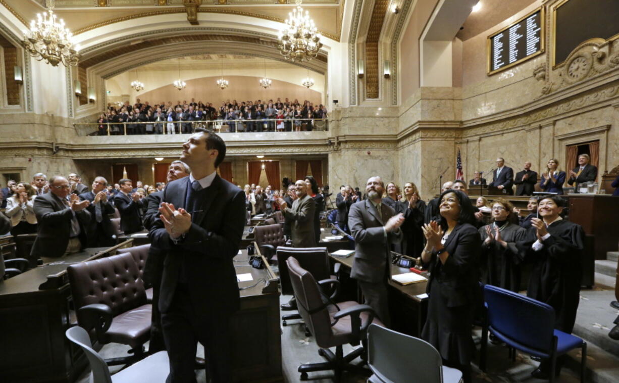 Legislators in a joint session applaud toward an upper gallery in the House chambers as Gov. Jay Inslee recognizes individuals during his annual state of the state address, in Olympia. A handful of races could decide whether there&#039;s a shake-up in the Washington Legislature this November, as Democrats hope to regain control of the Senate and Republicans have their eye on a majority in the House. All 98 seats in the House are up for election Nov. 8, and 26 of the Senate&#039;s 49 seats will also be decided by voters.