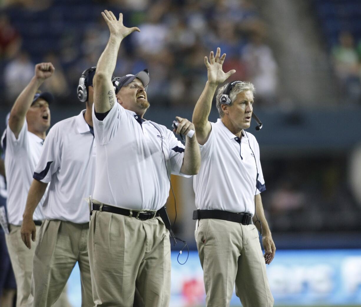 From 2010, Seattle Seahawks coaches Dan Quinn, defensive line, left, and head coach Pete Carroll, right.