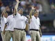 From 2010, Seattle Seahawks coaches Dan Quinn, defensive line, left, and head coach Pete Carroll, right.