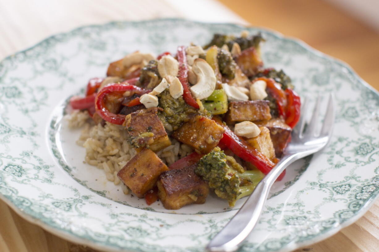 Sauteed Tofu With Broccoli and Red Peppers In Chili-Orange Sauce (AP Photo/Matthew Mead)