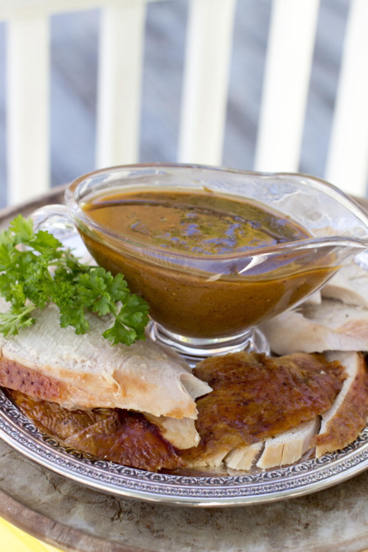 This Oct. 20, 2014, photo shows homemade gravy in Concord, N.H. The turkey stock used in this gravy recipe takes a few hours to make, but it is mostly hands off. The gravy itself also can be prepped ahead up to the point of needing the roasted turkey drippings, then quickly finished just before serving.