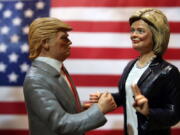 Statuettes depicting the presidential candidates Donald Trump, left, and Hillary Clinton are displayed in a shop in Via San Gregorio Armeno, the street of nativity scene craftsmen, in Naples, Italy, on Tuesday. On Nov. 8, Americans will vote for their next president.