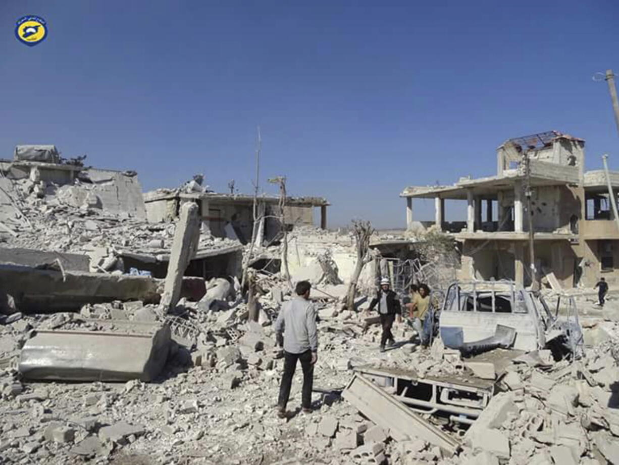 Syrians inspecting damaged buildings after airstrikes in the village of Hass in the Idlib province, Syria, on Wednesday.