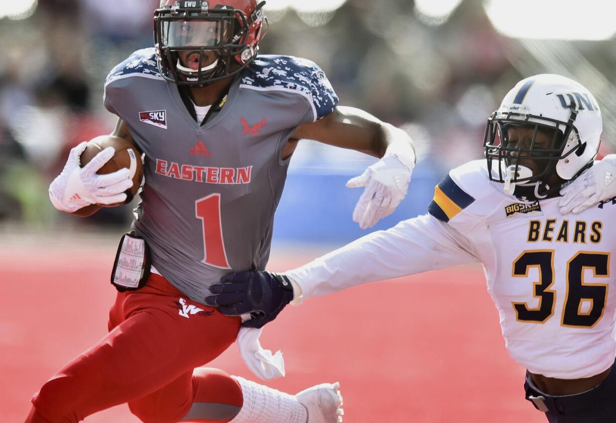 Eastern Washington Eagles wide receiver Shaq Hill (1) runs the ball against Northern Colorado Bears defensive back Michael Walker (36) during the first half of an NCAA college football game in Cheney, Wash., Saturday, Oct. 8, 2016.