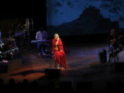 Buddhist nun and musician Ani Choying Drolma, center, performs during a concert in Mumbai, India.