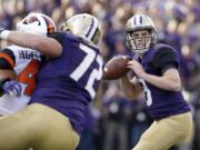 Washington quarterback Jake Browning drops back to throw a pass that led to a touchdown against Oregon State in the minutes of an NCAA college football game Saturday, Oct. 22, 2016, in Seattle.