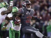 Washington State running back James Williams (32) scores a against Oregon on Saturday.