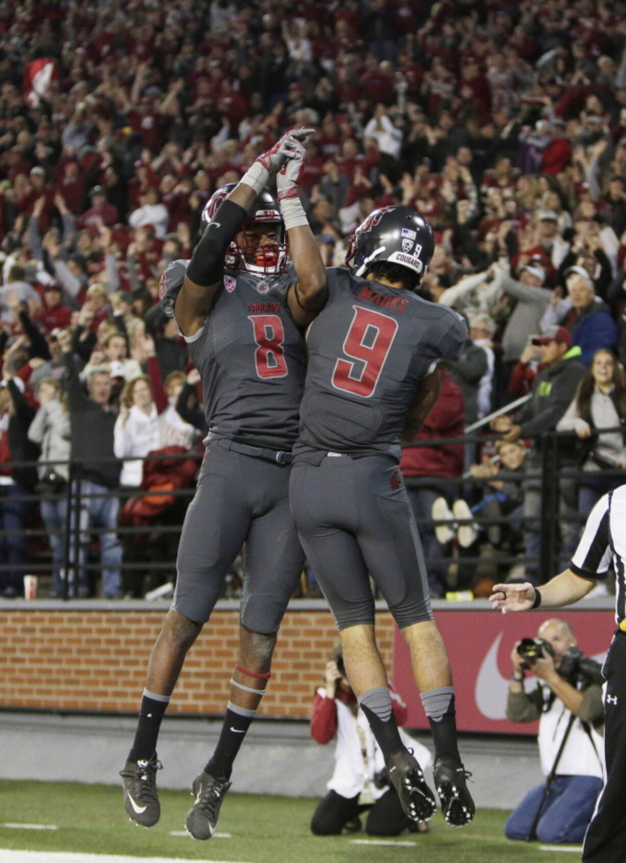 Washington State wide receiver Gabe Marks (9) and wide receiver Tavares Martin Jr. (8) celebrate a touchdown scored by Marks during the first quarter of the Cougars&#039; 51-33 win over Oregon on Saturday night in Pullman.