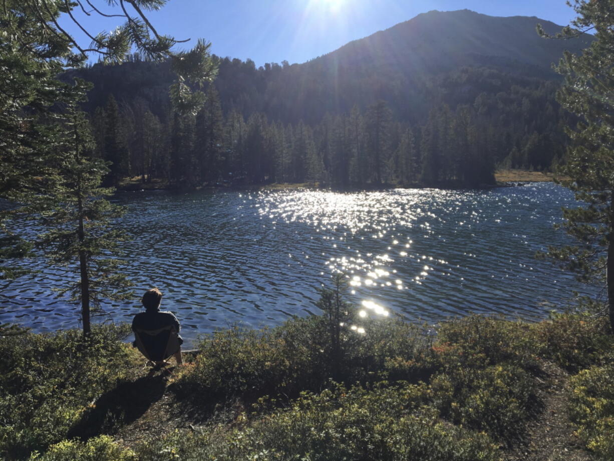 Kathryn Hunter takes in the sunset Sept. 10 over Washington Lake northeast of Sun Valley, Idaho, in the White Cloud Mountains.