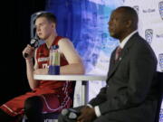 Washington State forward Josh Hawkinson, left, answers questions as head coach Ernie Kent, right, listens during NCAA college basketball Pac-12 media day Friday, Oct. 21, 2016, in San Francisco.