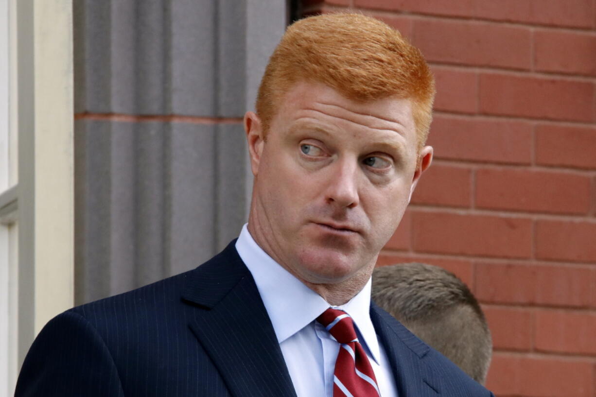 FILE - In this Oct. 17, 2016, file photo, former Penn State University assistant football coach Mike McQueary leaves the Centre County Courthouse Annex for lunch in Bellefonte, Pa. Lawyers for the former Penn State assistant football coach are urging jurors to find the university liable for how it treated him after it became public that his testimony helped prosecutors charge Jerry Sandusky with child molestation. Both sides in the defamation and whistleblower lawsuit filed by McQueary made closing arguments Thursday, Oct. 27. (AP Photo/Gene J.