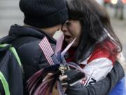 Maureen Valdez, right, cries and hugs another supporter after hearing a verdict outside federal court in Portland, Ore., Thursday, Oct. 27, 2016. A jury exonerated brothers Ammon and Ryan Bundy and five others of conspiring to impede federal workers from their jobs at the Malheur National Wildlife Refuge.