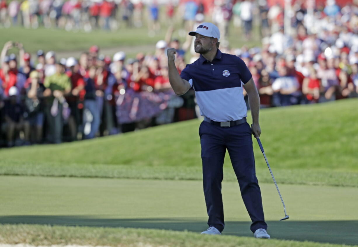 United States' Ryan Moore reacts after winning the 17th hole during a singles match at the Ryder Cup golf tournament Sunday, Oct. 2, 2016, at Hazeltine National Golf Club in Chaska, Minn.