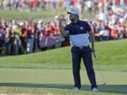 United States' Ryan Moore reacts after winning the 17th hole during a singles match at the Ryder Cup golf tournament Sunday, Oct. 2, 2016, at Hazeltine National Golf Club in Chaska, Minn.