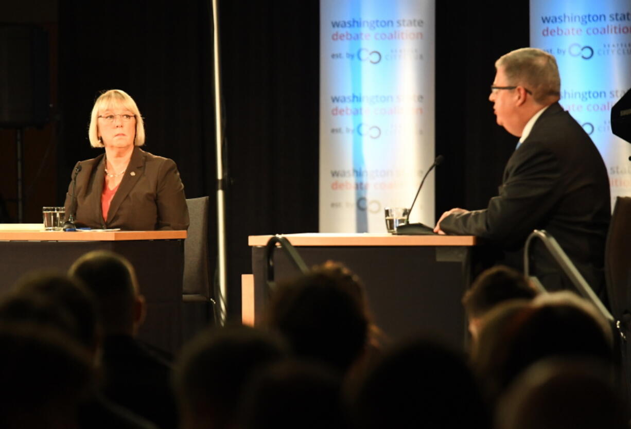 Senator Patty Murray, left, listens to challenger Chris Vance, right, make a point during their debate Sunday, Oct. 16, 2016 at Gonzaga University, in Spokane, Wash.