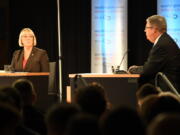 Senator Patty Murray, left, listens to challenger Chris Vance, right, make a point during their debate Sunday, Oct. 16, 2016 at Gonzaga University, in Spokane, Wash.