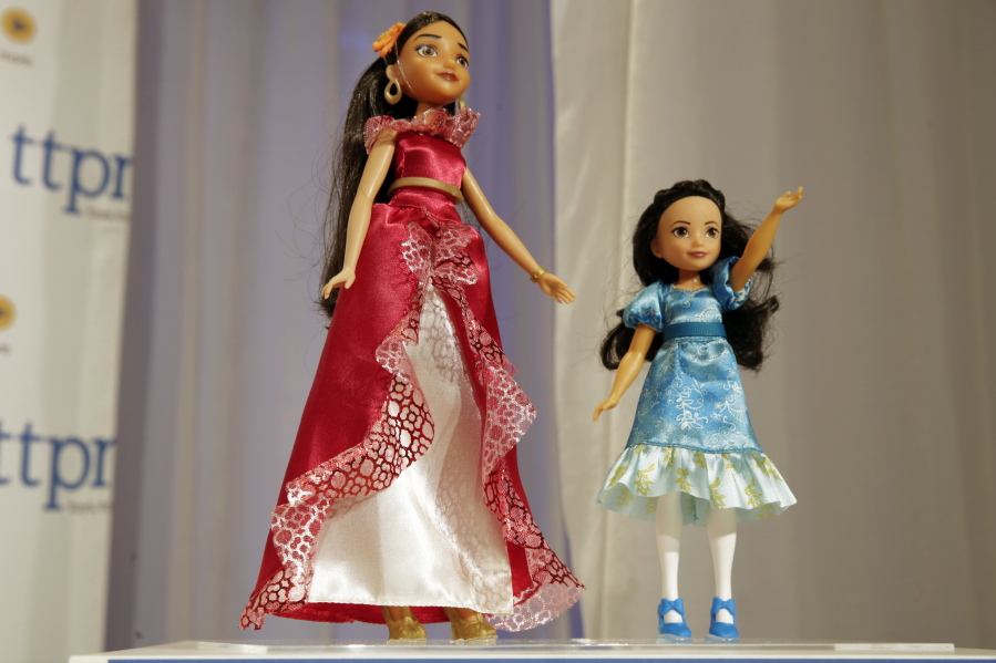 Wal-Mart, Toys R Us price black, white Barbies differently