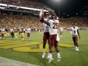 Washington State running back Jamal Morrow (25) celebrates his touchdown catch with teammate Isaiah Johnson-Mack during the second half of an NCAA college football game against Arizona State, Saturday, Oct. 22, 2016, in Tempe, Ariz.