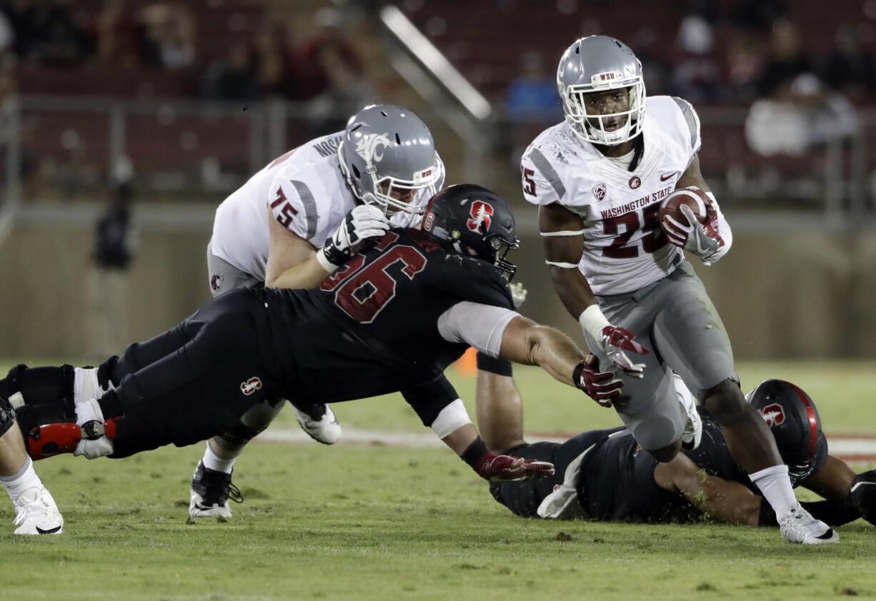 Washington State running back Jamal Morrow, right, runs past Stanford defensive tackle Harrison Phillips during the second half of an NCAA college football game Saturday, Oct. 8, 2016, in Stanford, Calif.