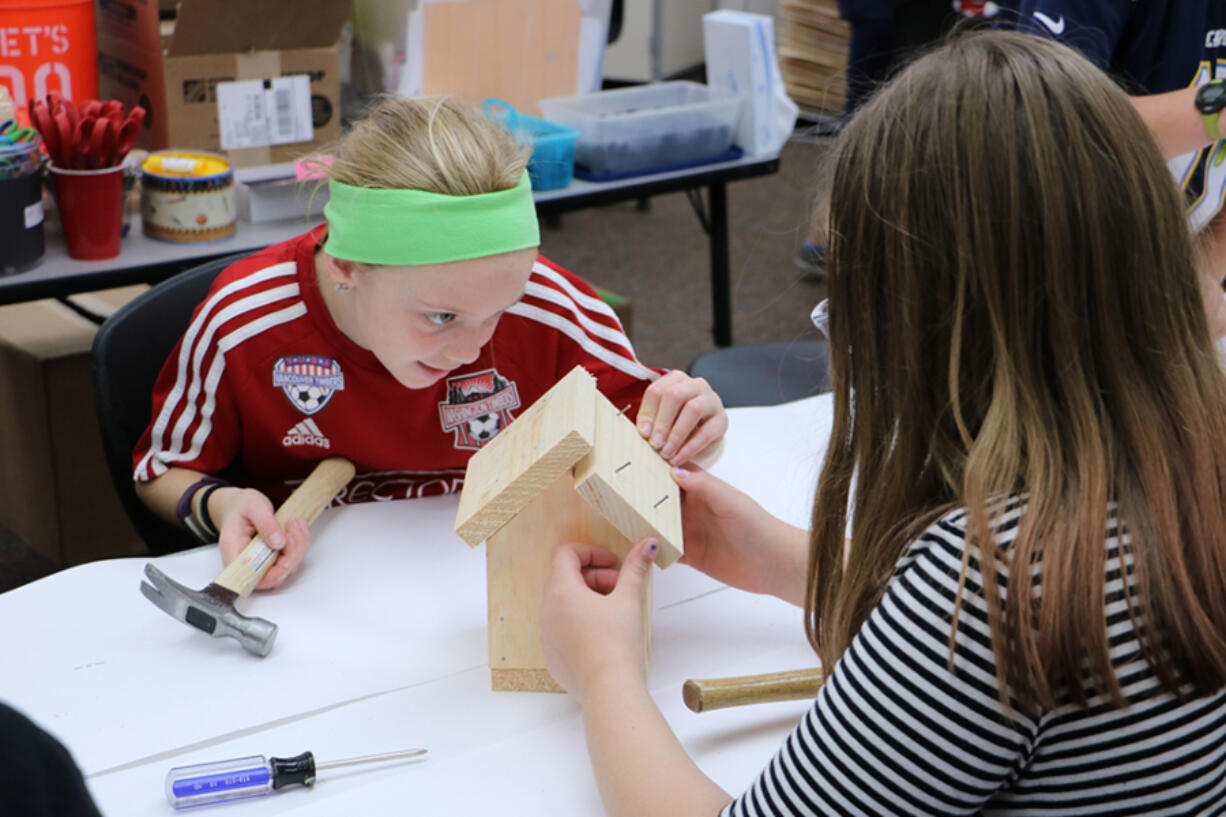 Battle Ground: Laurin Middle School fifth-graders Ryleigh Hall-McBride, left, and Ava Hanna work on birdhouses, which will be on sale in November at the school&#039;s inaugural Winter Bazzar, with proceeds going to the art department.