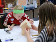 Battle Ground: Laurin Middle School fifth-graders Ryleigh Hall-McBride, left, and Ava Hanna work on birdhouses, which will be on sale in November at the school&#039;s inaugural Winter Bazzar, with proceeds going to the art department.