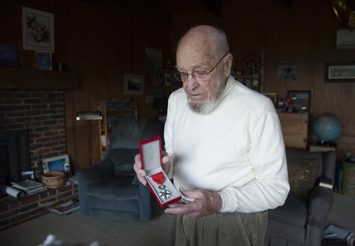 Dr. Ed McAninch, a longtime Camas physician, displays the French Legion of Honor medal he received in December for his World War II service.