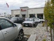 Customers try to find parking in the crowded Chick-Fil-A parking lot in east Vancouver.