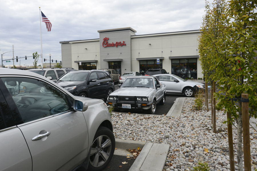 Customers try to find parking in the crowded Chick-Fil-A parking lot in east Vancouver.