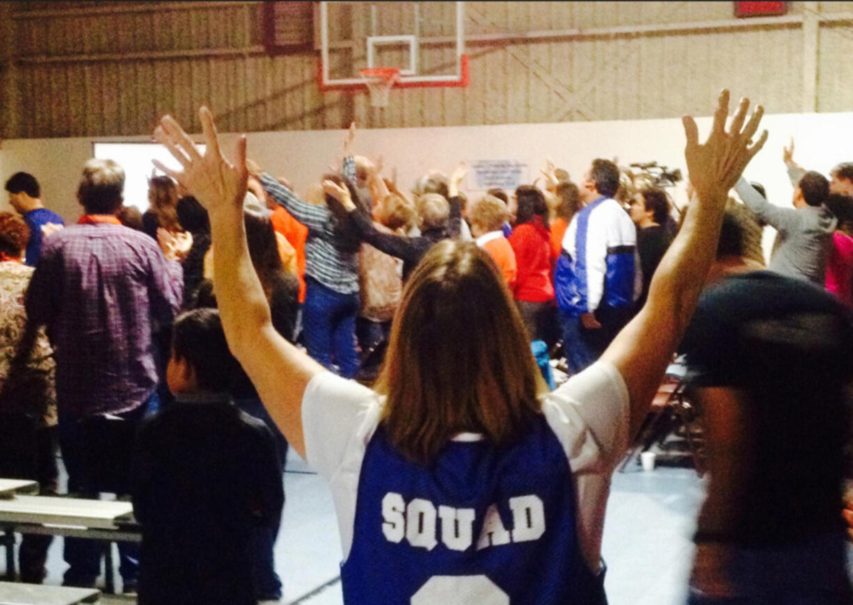 A church volunteer during a new Friday night service at Valley Dream Center, led by Coach Dave Standley.