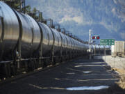 A train hauling oil passes through the Columbia River Gorge in March 2014 on its way to Vancouver.