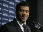 Seattle Seahawks quarterback Russell Wilson speaks to the media following an NFL football game against the New England Patriots, Monday, Nov. 14, 2016, in Foxborough, Mass.