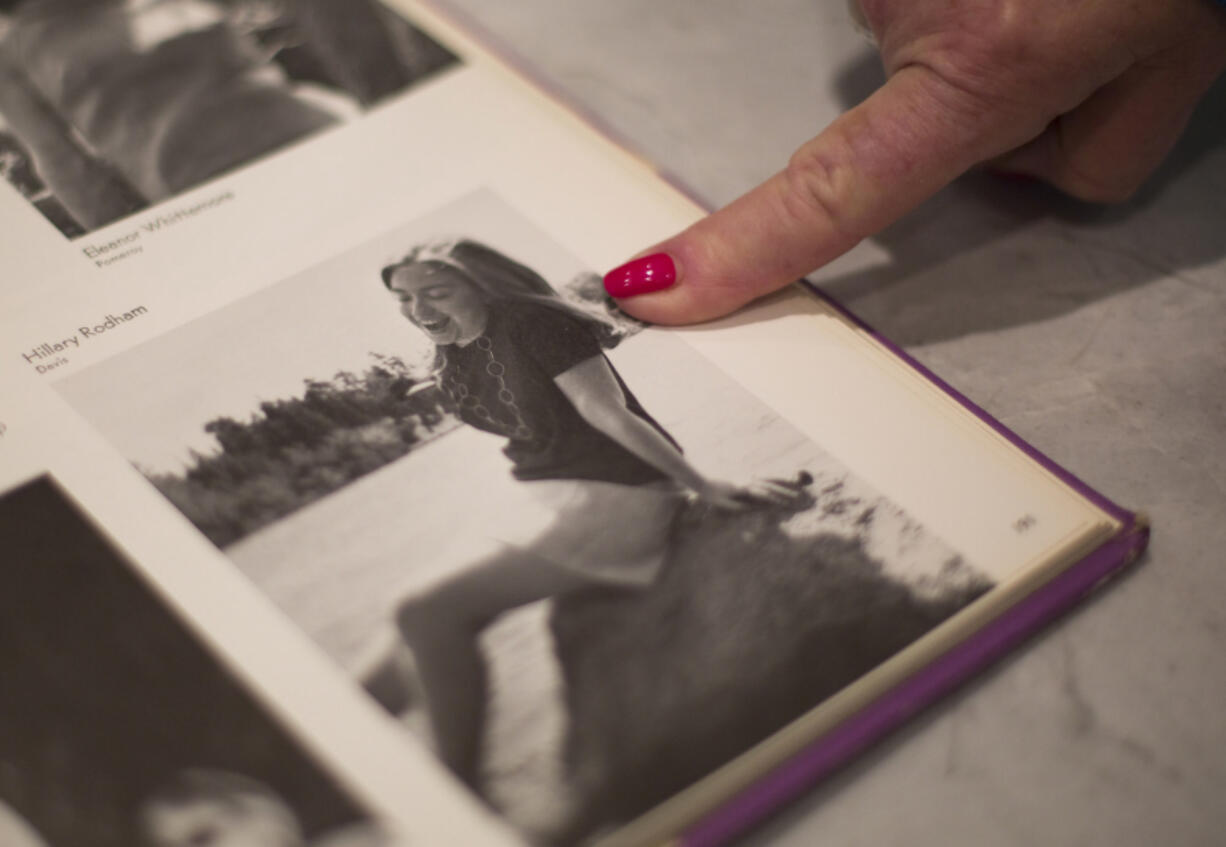 Vancouver resident Candace Young pulls out her 1969 Wellesley College yearbook and points to a photo of her classmate, Hillary Rodham.