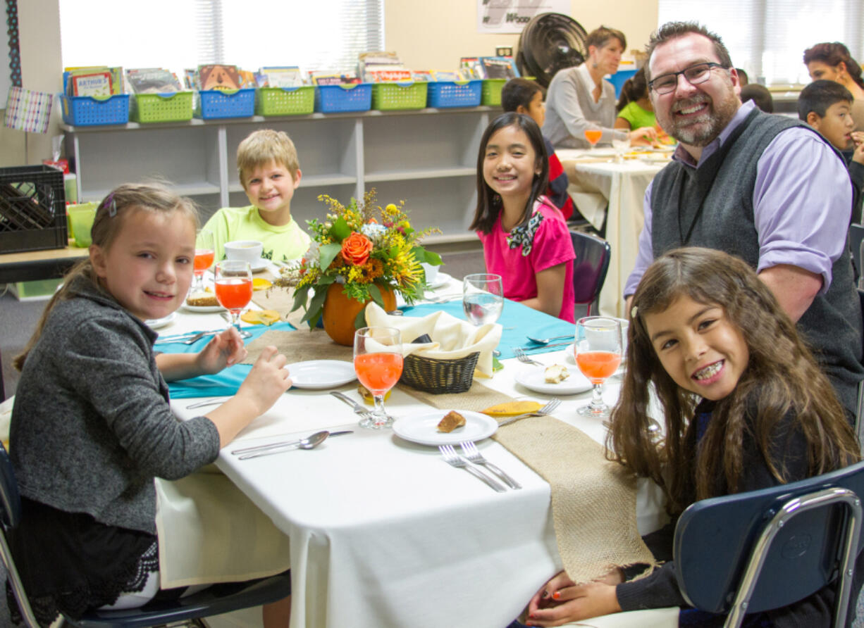 Woodland: Woodland Intermediate School third-graders Marissa Lindberg, from left, Aidan Summers, Faithe Moran and Ari Asher with Principal Steve Carney at the school&#039;s annual Fine Dining Event.