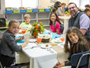 Woodland: Woodland Intermediate School third-graders Marissa Lindberg, from left, Aidan Summers, Faithe Moran and Ari Asher with Principal Steve Carney at the school&#039;s annual Fine Dining Event.