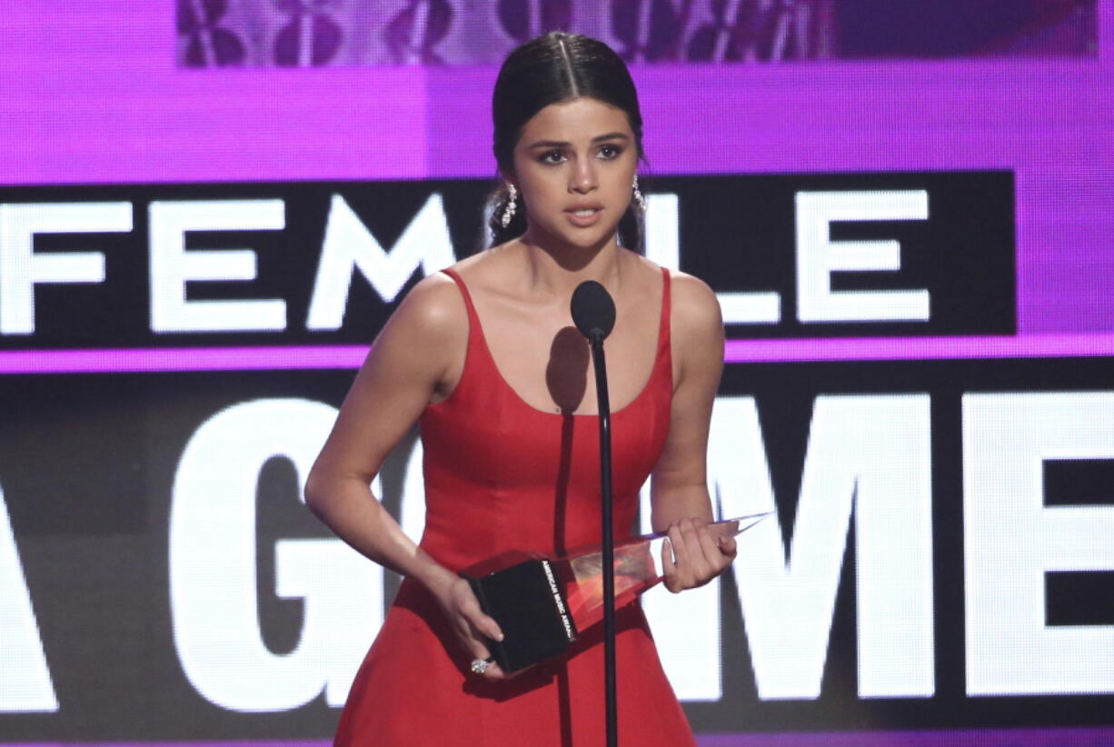 Selena Gomez accept the favorite female artist pop/rock award at the American Music Awards at the Microsoft Theater on Sunday in Los Angeles.