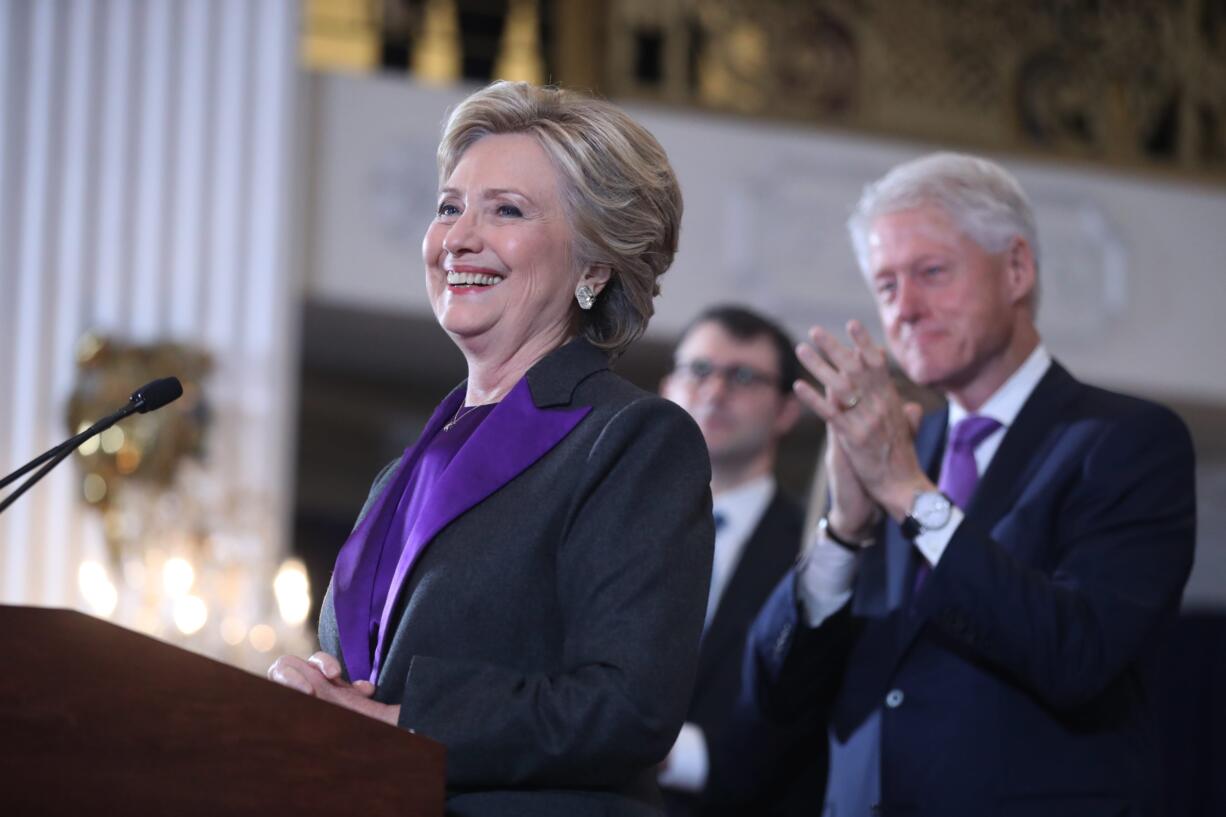 Former President Bill Clinton applauds as his wife, Democratic presidential candidate Hillary Clinton speaks in New York, Wednesday, Nov. 9, 2016. Clinton conceded the presidency to Donald Trump in a phone call early Wednesday morning, a stunning end to a campaign that appeared poised right up until Election Day to make her the first woman elected U.S. president.