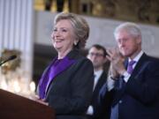 Former President Bill Clinton applauds as his wife, Democratic presidential candidate Hillary Clinton speaks in New York, Wednesday, Nov. 9, 2016. Clinton conceded the presidency to Donald Trump in a phone call early Wednesday morning, a stunning end to a campaign that appeared poised right up until Election Day to make her the first woman elected U.S. president.