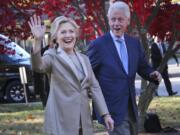 Democratic presidential candidate Hillary Clinton, and her husband former President Bill Clinton, greet supporters after voting in Chappaqua, N.Y., Tuesday, Nov. 8, 2016.