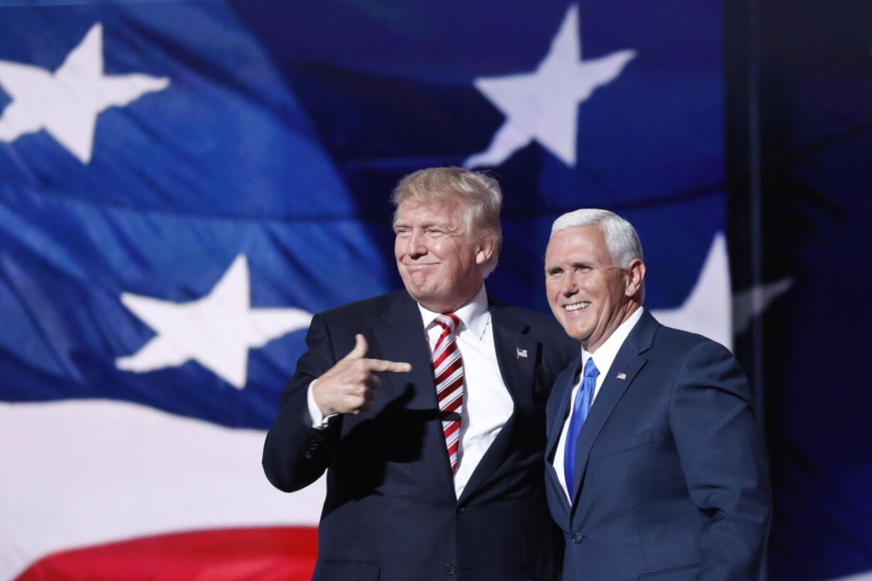 Republican presidential candidate Donald Trump, points toward Republican Vice presidential candidate Gov. Mike Pence of Indiana after Pence&#039;s acceptance speech during the third day session of the Republican National Convention in Cleveland, Wednesday, July 20, 2016.