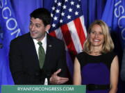 House Speaker Paul Ryan of Wisconsin smiles with his wife Janna at a campaign rally in Janesville, Wis., Tuesday, Nov. 8, 2016.