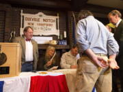 Voters in Dixville Notch, N.H., get their ballots Tuesday, Nov. 8, 2016, in Dixville Notch, N.H. The residents in town voted just after midnight.