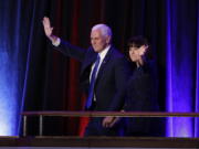 Vice-President-elect Mike Pence and his wife Karen Pence waves as they arrive during his election night rally, Wednesday in New York.