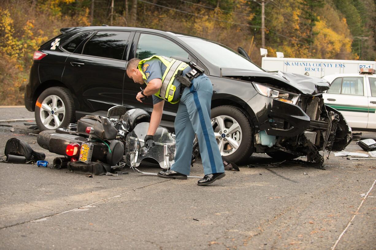 A state trooper examined a motorcycle v. SUV crash near Beacon Rock State Park on Thursday afternoon. Both drivers were hospitalized.