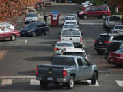 A steady stream of voters drop off their ballots along West 14th Street on Monday afternoon, the day before the election.